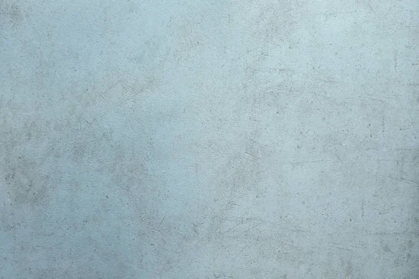 Jasnoniebieski brudny cement ściana tło. — Zdjęcie stockowe