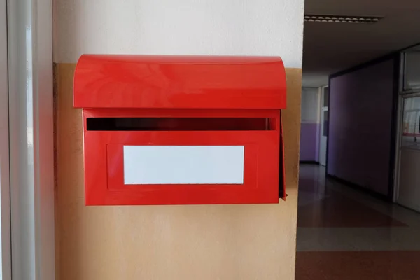 Red postal box or Red post box on wall.