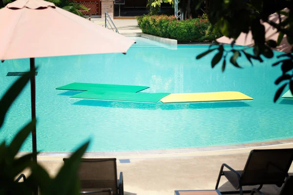 Floating foam on Empty pool in the daytime.