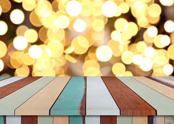Podlaha dřevěného stolu a vánoční bokeh pozadí. — Stock fotografie