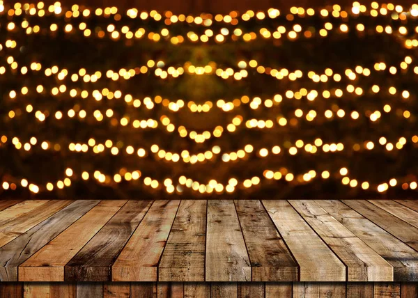 Fußboden aus Holz Tisch und Weihnachten Bokeh Hintergrund. — Stockfoto