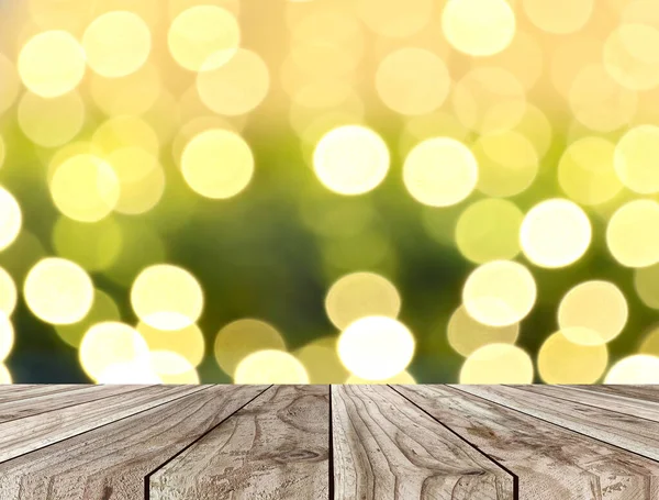 Fußboden aus Holz Tisch und Weihnachten Bokeh Hintergrund. — Stockfoto