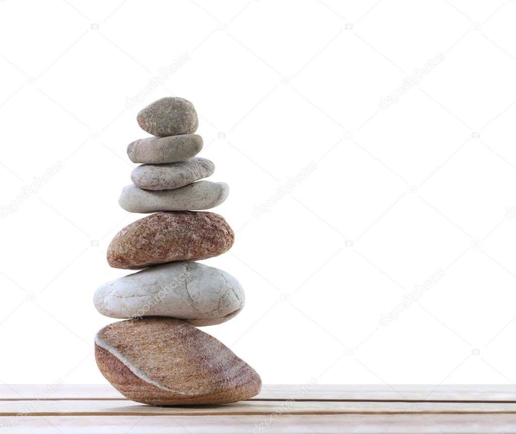 Balance stones are arranged in a pyramid shape,Stone stacked isolated on white background and have clipping paths for easy design in your concept.