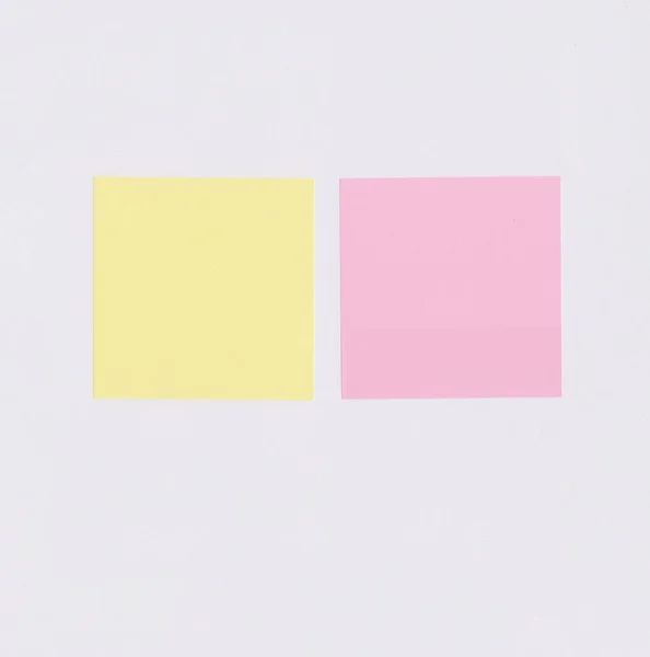 Colorful square note paper on white paper background and have copy space for you design.