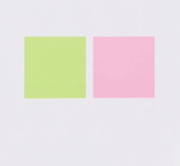 Colorful square note paper on white paper background and have copy space for you design.