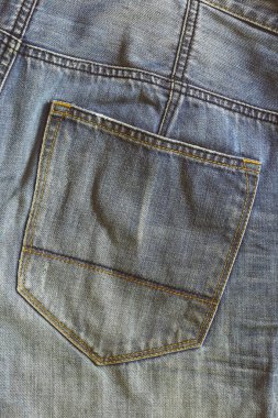 Mavi Denim arka planının eski dokusu. İş arkaplanı konseptinizde tasarım için dikey görüntü Blue Jeans vintage deseni.