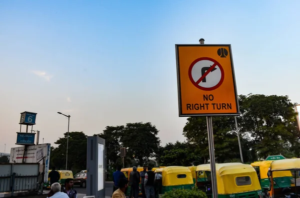Street signs are necessary as they let people know about what to do on the roads. This is a low angle shot of a no right turn street sign in Connaught Place, Central Delhi, India