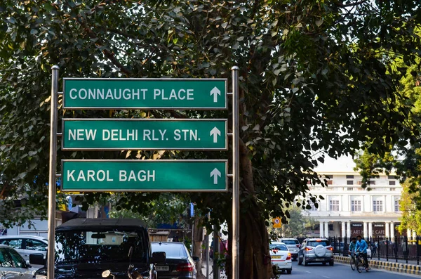Street signs and directions on green board in Connaught Place Delhi, India, Circa 2018. One can find these green sign boards all over Delhi