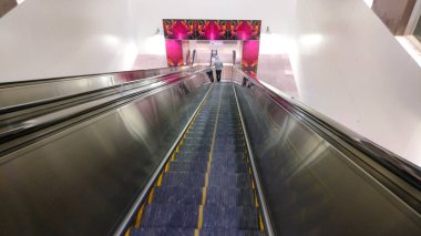 going down an escalator in metro station