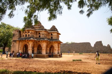 Tourists visiting the Lotus Mahal Palace in Hampi, Karnataka, India. Hampi Utsav clipart