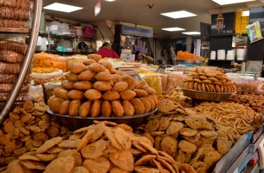 editorial - store font displaying ready to eat fried snack food in chandni chowk delhi