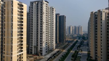 Modern high-rise multi-story luxury   residential apartment society building in Delhi NCR, Mumbai, Pune, Hyderabad, Lucknow, Jaipur, Kolkata, Noida, Gurgaon, Chennai,Bangalore, Raipur,Amaravati, India clipart