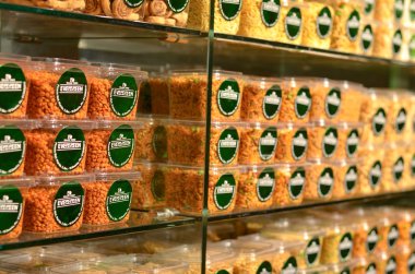 rows of different types of food in a supermarket