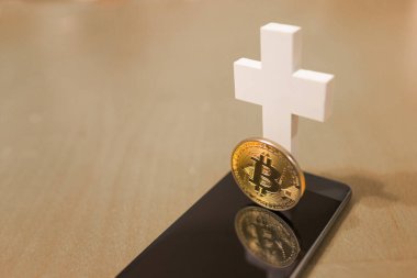 Smartphone ve beyaz haç ile Bitcoin