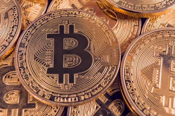 Bitcoin gold coins laying on each other — Stock Photo, Image