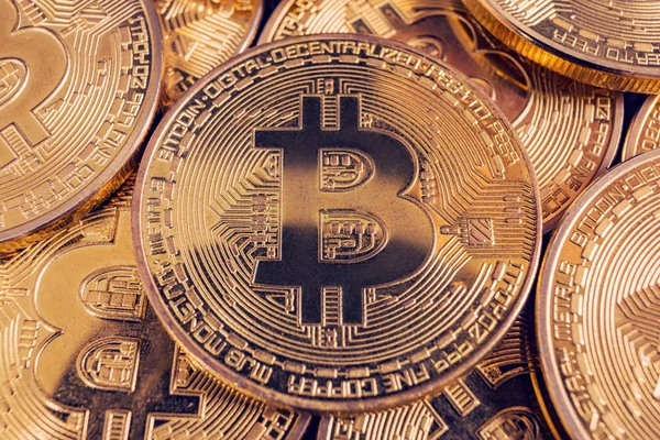 Bitcoin gold coins laying on each other — Stock Photo, Image