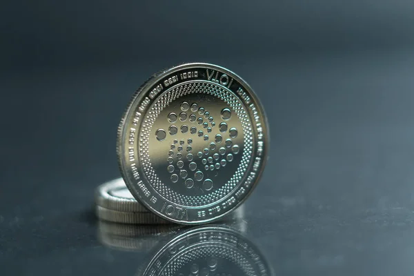 IOTA. Crypto currency silver coin, Macro shot of Iota coin isolated on background, cut out Blockchain technology,