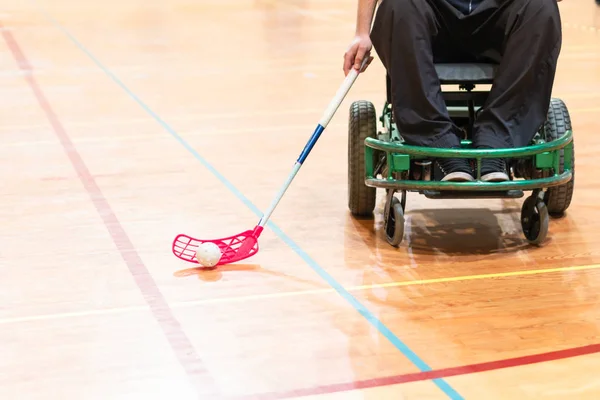 Disabled man on an electric wheelchair playing sports, powerchair hockey. IWAS - International wheelchair and amputee sports federation — Stock Photo, Image