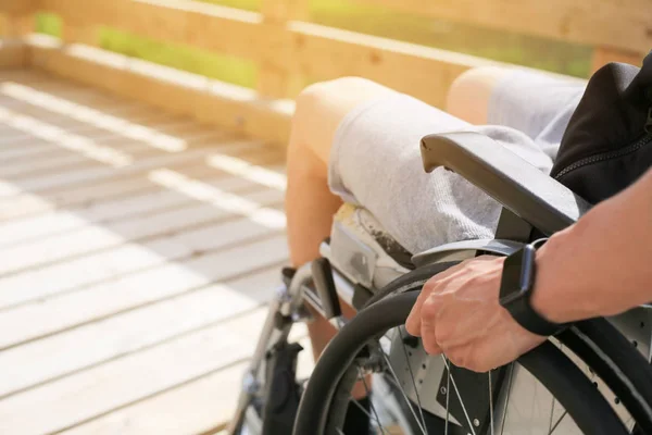 Disabled young man on a wheelchair — Stock Photo, Image