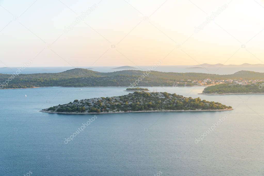 Islands on sea with sun flare - Kornati National Park Croatia