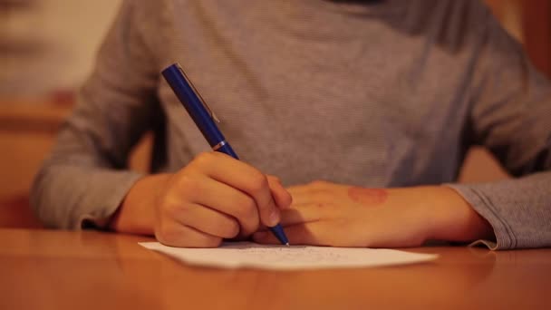 Child hands writing a letter — Stock Video