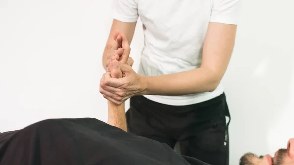 Physiotherapist with disabled person — Stock Photo, Image