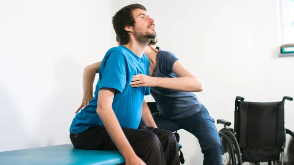 Physiotherapist with disabled person — Stock Photo, Image