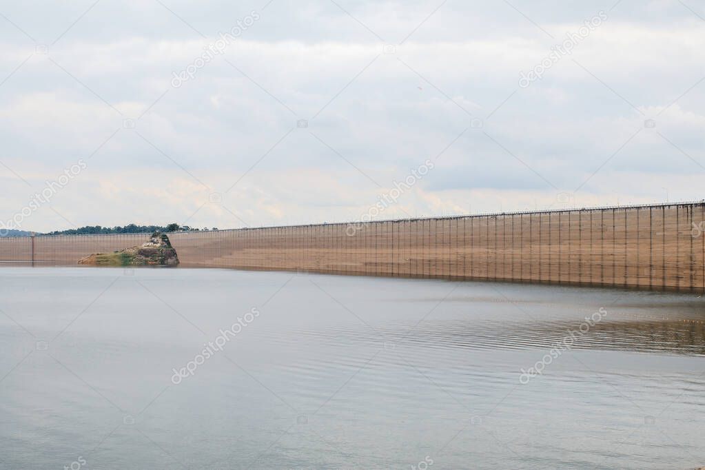 It is a concrete arch-gravity dam at Khun Dan Prakan Chon, Roller Compacted Concrete Dam, Nakornnayok, Thailand.