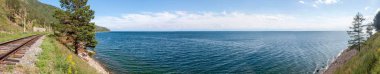 beautiful panorama of lake Baikal on a clear day clipart