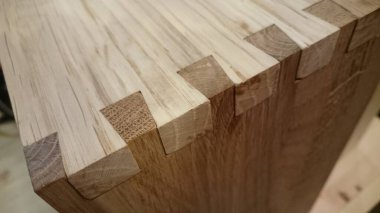 Dovetail joinery on oak wood clipart