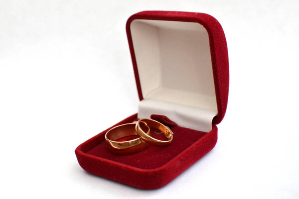 wedding ring in a red gift box with a white background