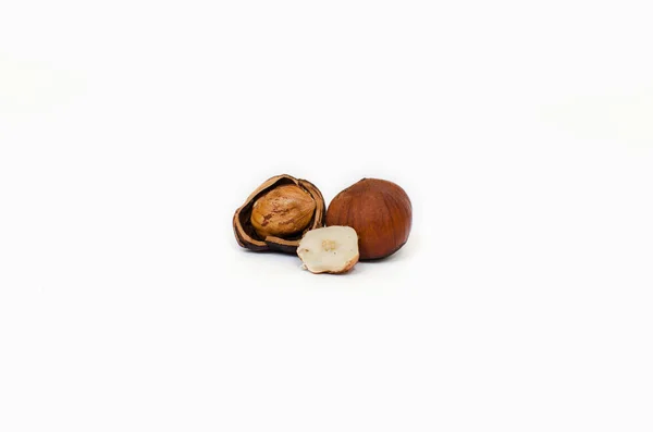 Close up of hazelnuts, isolated on the white background, clipping path included., with a place for the text — стоковое фото