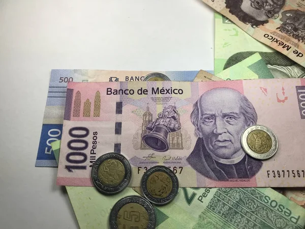 Mexican peso bills spread over white background — Stock Photo, Image