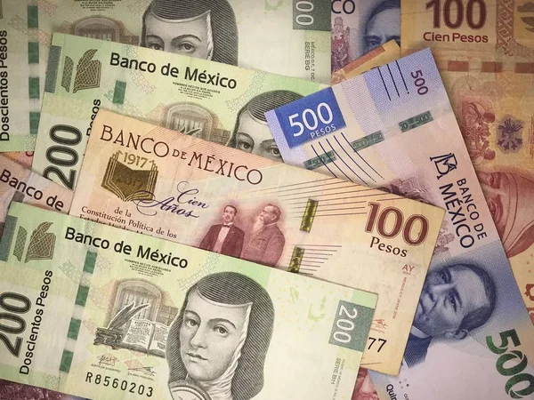 Mexican peso bills spread randomly over a flat surface — Stock Photo, Image