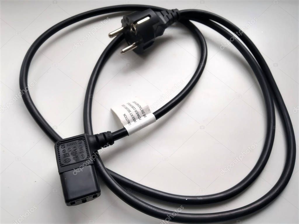 cord of connection of power supply of household appliances of black color with grounding on 3 contacts