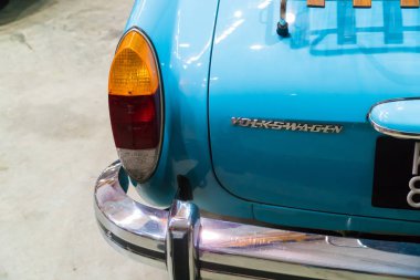 KUALA LUMPUR, MALAYSIA - JULY 28, 2018: Close-up tail light from Volkswagen Karmann-Ghia at Festival Art of Speed in Kuala Lumpur, Malaysia clipart