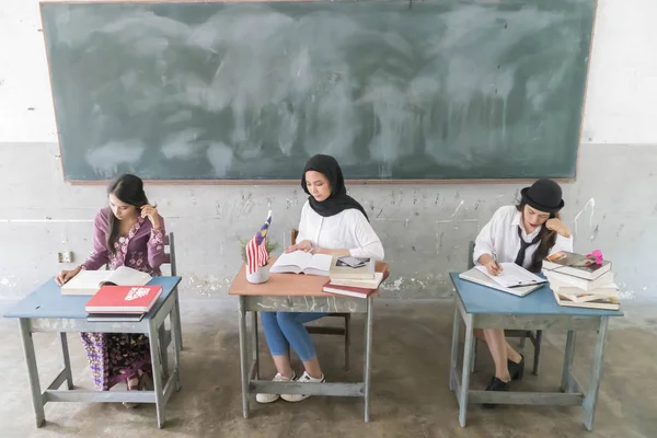 Student at the classroom studying