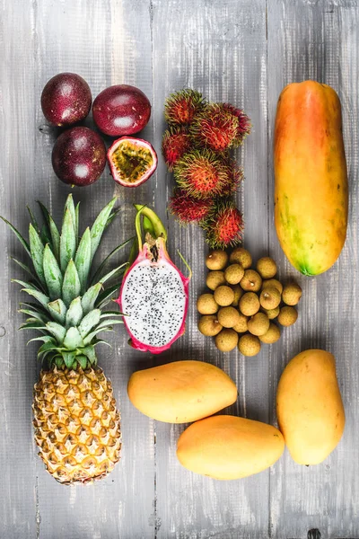 Set of exotic fruits. Assorted tropical fruits of pineapple, dragon fruit, rambutan, passion fruit, mango, longan, papaya