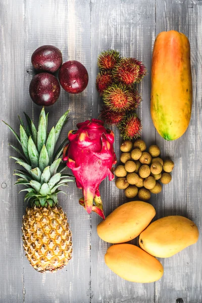 Set of exotic fruits. Assorted tropical fruits of pineapple, dragon fruit, rambutan, passion fruit, mango, longan, papaya