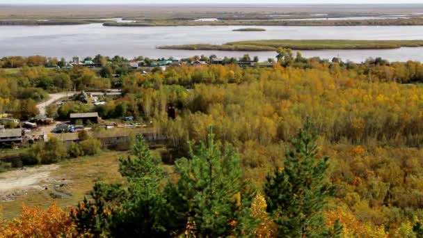 View from the hill to the village, forest and river in the fall and open space — Stock Footage View Hill Village Forest River Fall Open Space Royalty Free Stock Video