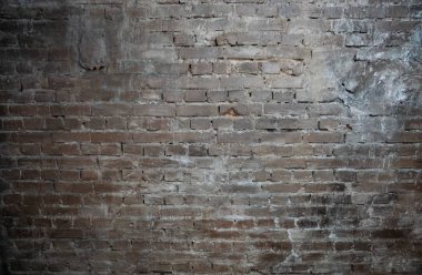 Arka plan ışık dikişleri ile kahverengi tuğladan bir duvar şeklinde