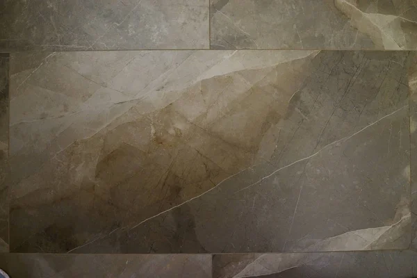 Büyük bir taş döşemenin katında doğal taş (granit, mermer) dokusu