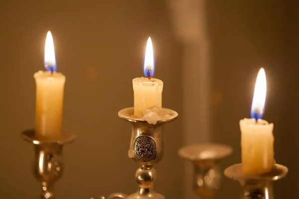 Three candles on a candlestick