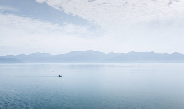 Fishermans boats at sea at dawn.