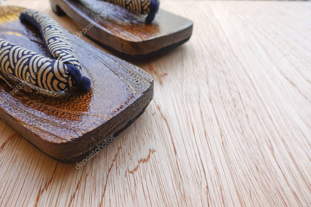Close-up of Japanese clogs called Geta on wooden background