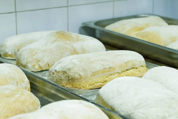 Making bread ciabatta at the bakery. The cooking process.