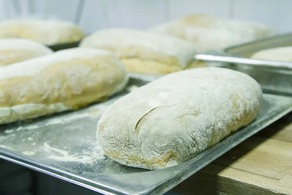 Making bread ciabatta at the bakery. The cooking process.