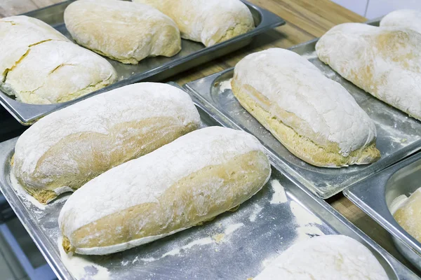 Making bread ciabatta at the bakery. The cooking process.