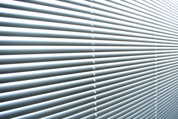 Closed metal blinds, sunlight reflection