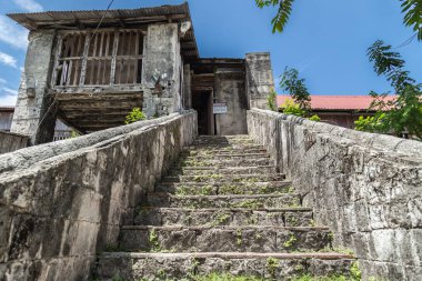 old stone staircase in Baclayon catolic Church in Bohol Island, Philippines. clipart